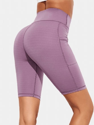 Enfärgad Ficka Slim Hip Lift Yoga Leggings